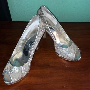 Silver Nine West open toe heels.